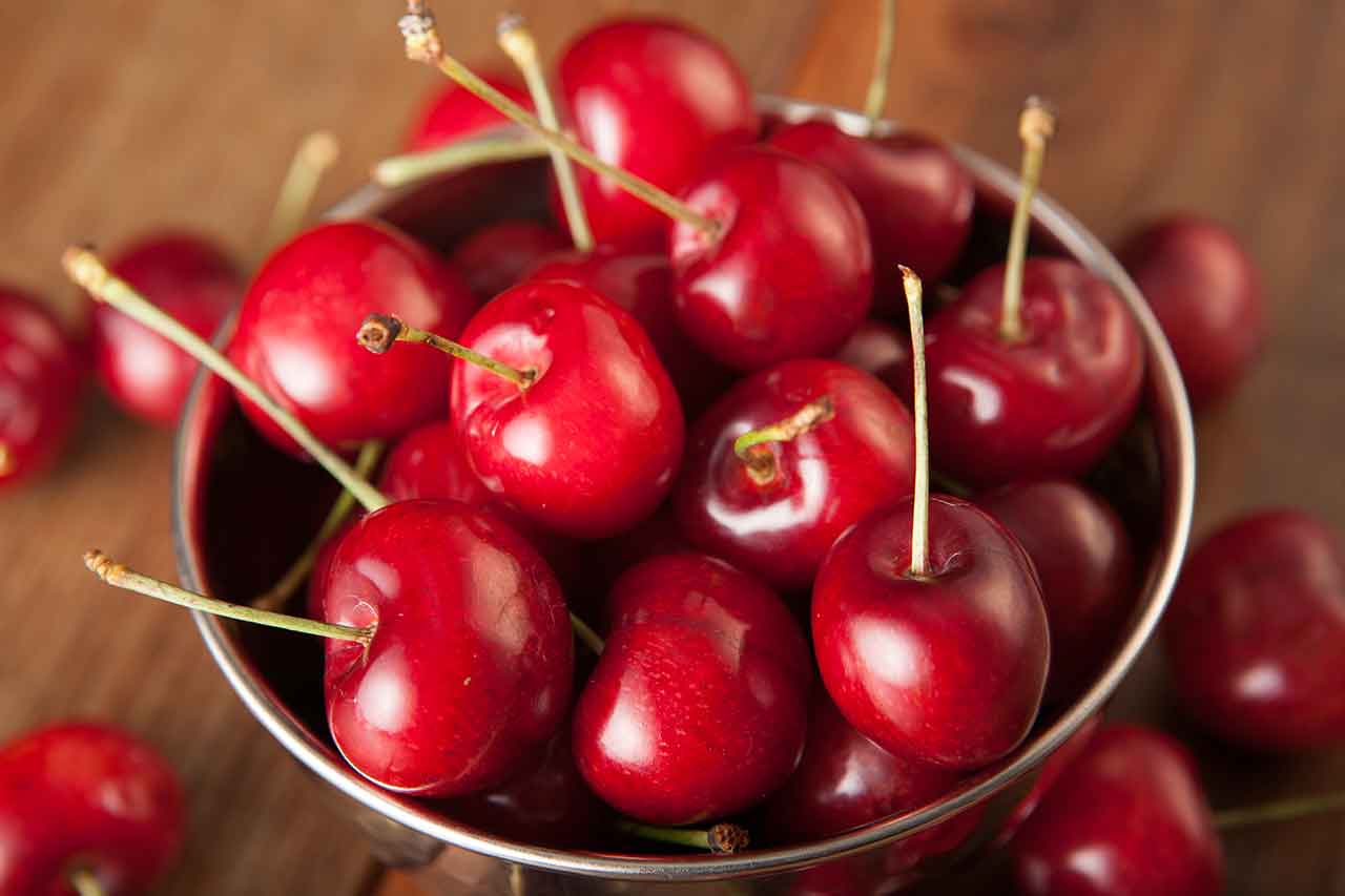 Cherries in a metal bowl