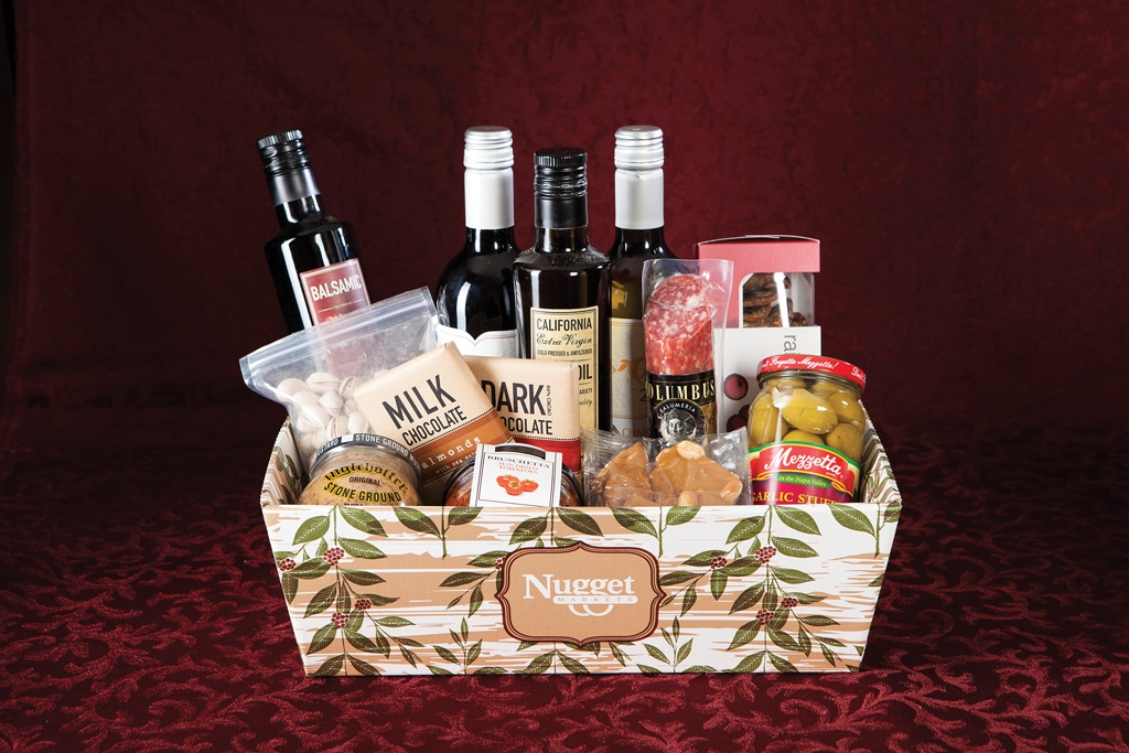Wine Gift Basket  The Wine Basket includes salami, crackers, wine (or sparkling cider, if you prefer), Fresh to Market Extra Virgin Olive Oil and Balsamic Vinegar, Fresh to Market chocolate, olives and nuts.
