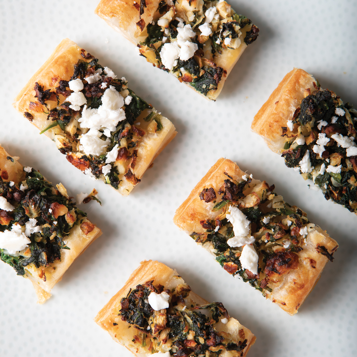 feta and spinach puffs on a plate