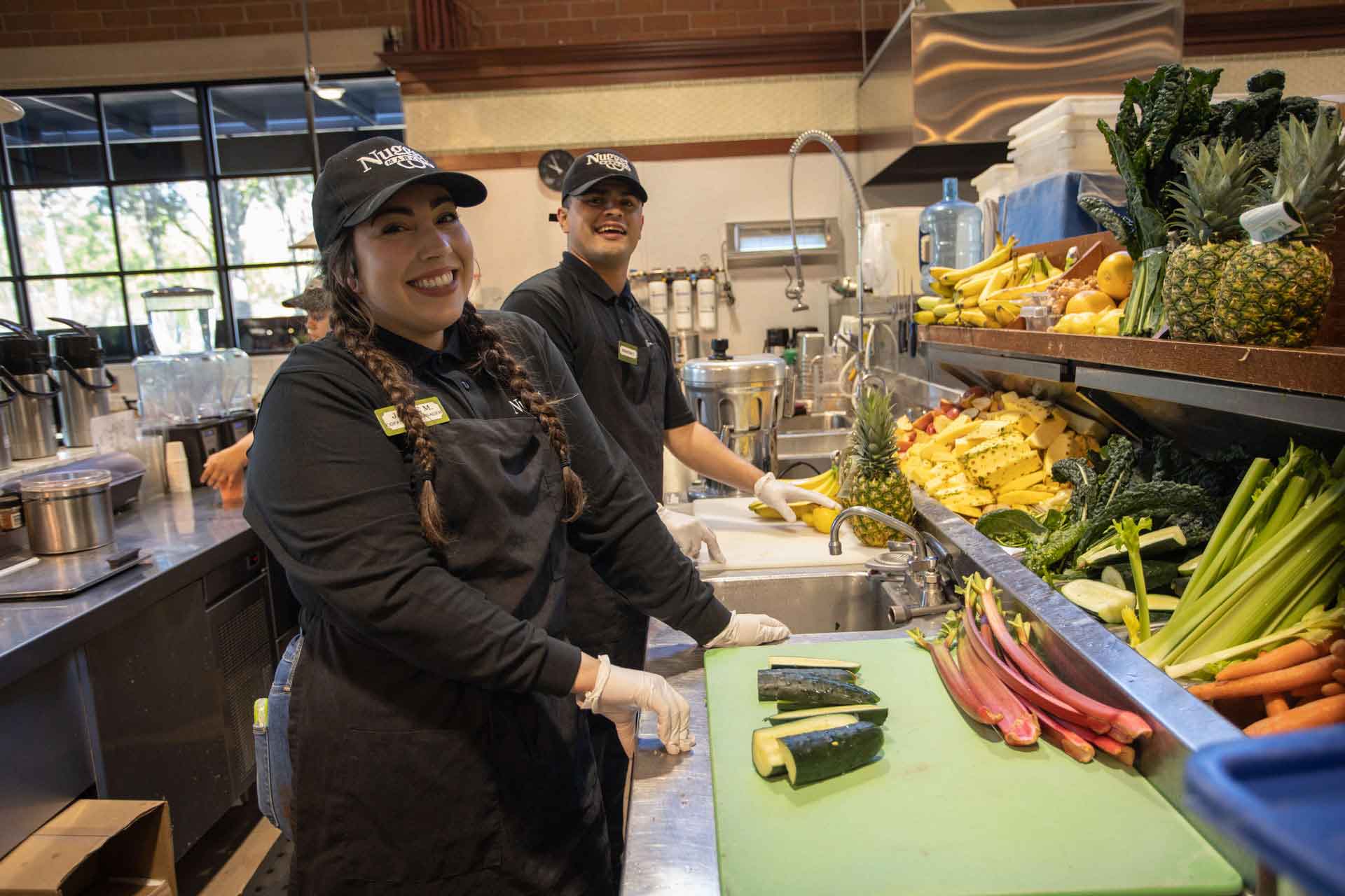 Nugget Markets coffee bar associates chopping vegetables
