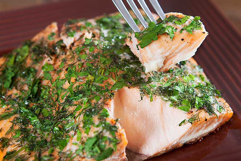 herbed salmon fillet with fork
