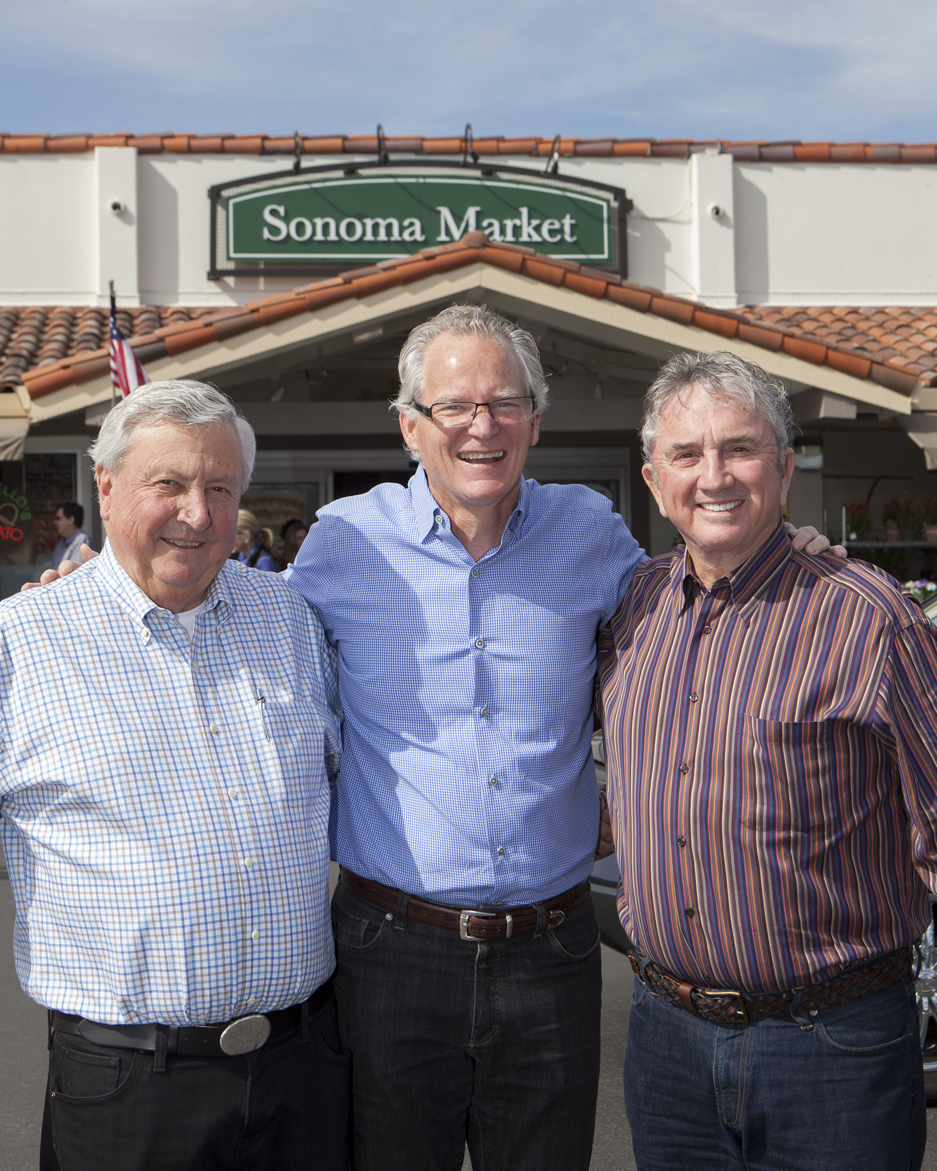 Don Shone and Dale Downing (left and right), co-owners of Sonoma Markets, celebrate with Eric Stille, president and CEO of Nugget Markets.