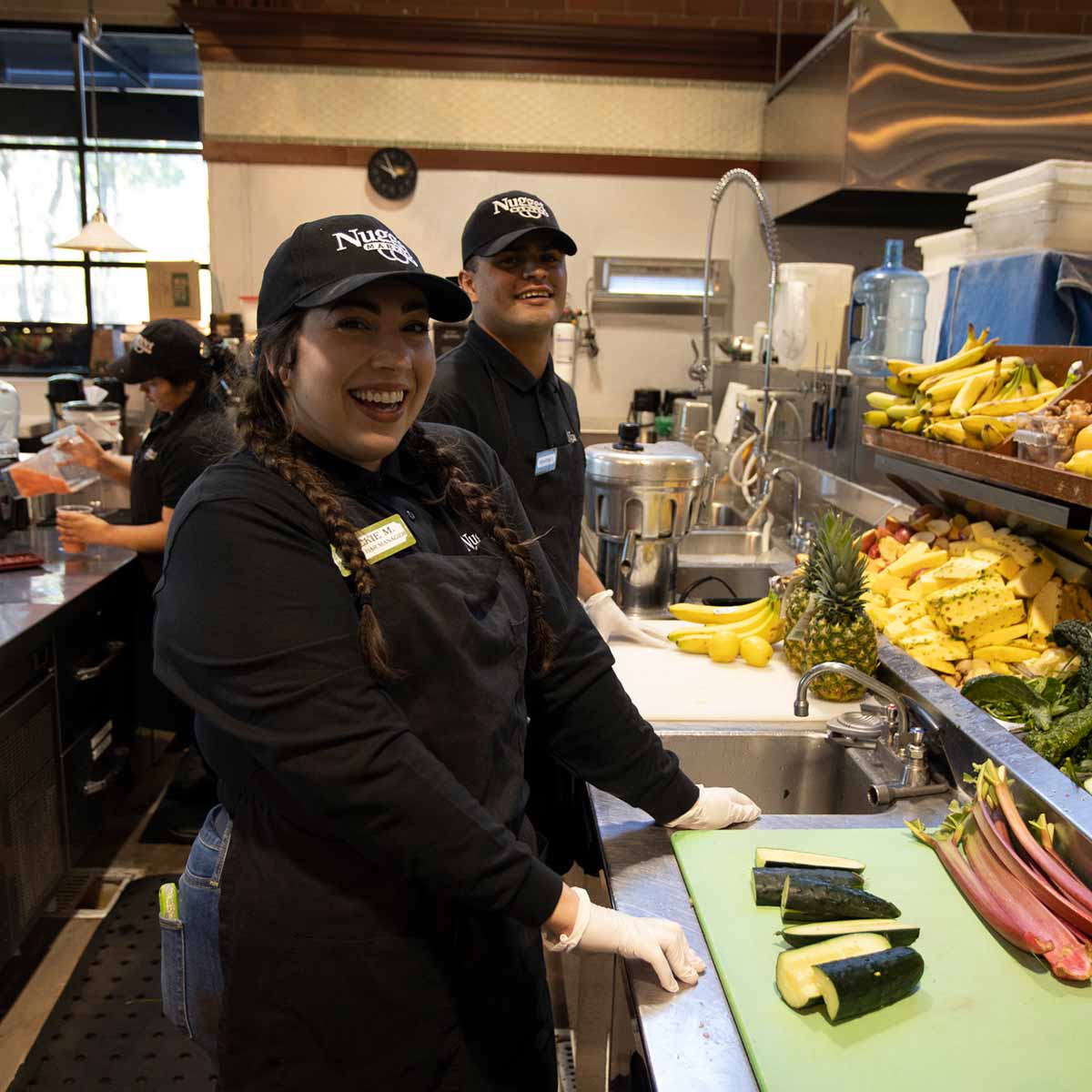 Nugget Markets coffee bar associates chopping vegetables Nugget