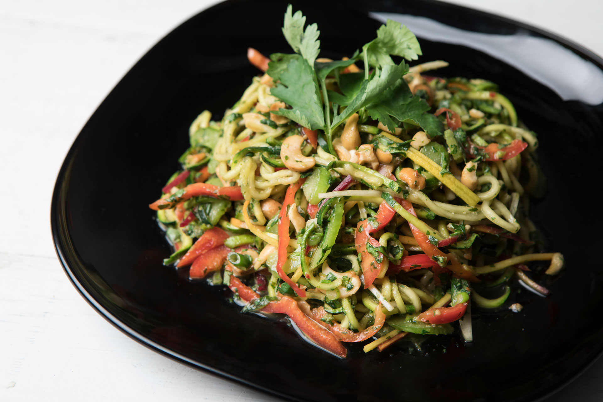 thai zoodle on a black plate