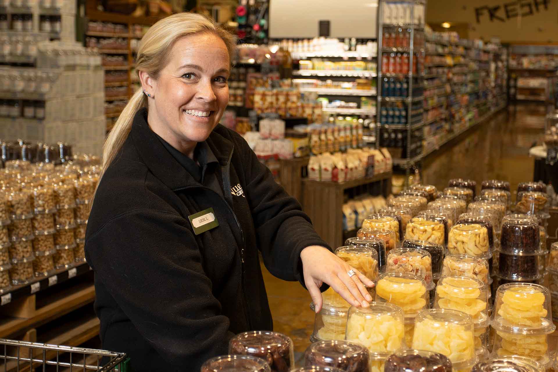 Nugget Markets associate in bulk foods section